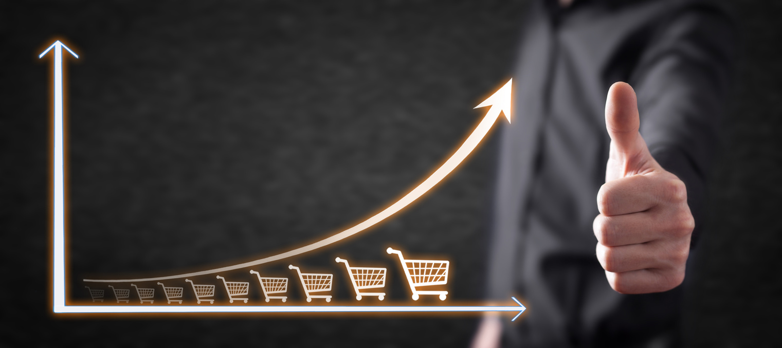 Shopping cart and growth graph. Increase in sales